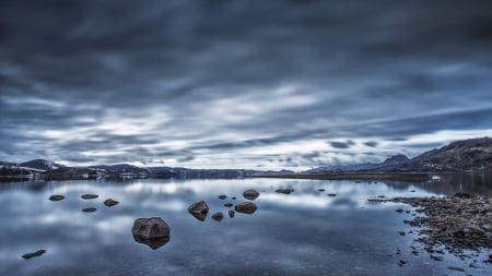 beautiful lake kleifarvatn in iceland - shallow, lake, clouds, rocks