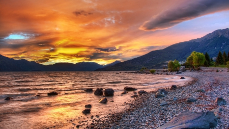 lovely sunset over a beautiful lake - clouds, shore, sunset, lake, mountains, stones