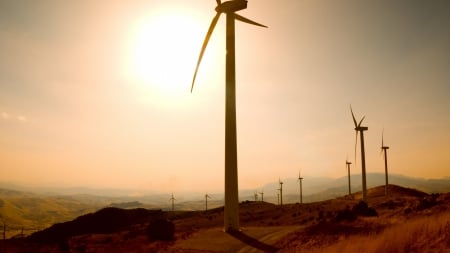 brilliant sun over windmills  - windmills, hills, turbines, sunshine