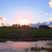 Sunset over little Latvian church.