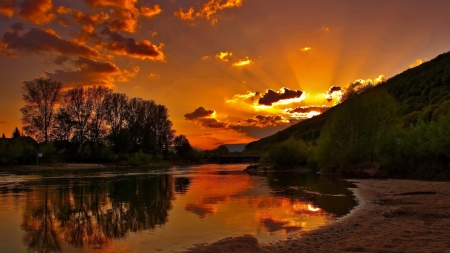 river at a beautiful sunset - trees, reflection, river, clouds, beams, sunset