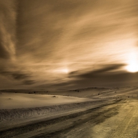 road in winter under magical sky