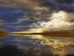 storm clouds reflected on a lake