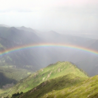 rainbow over a green valley 