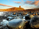 dunstanburgh castle on english rocky shore