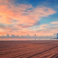 massive raked beach under gorgeous sky