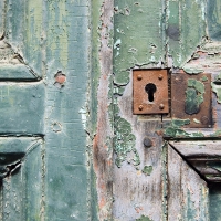 Rotten Door With a Rusty Lock