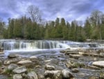 waterfall into a rocky river hdr