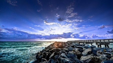 wooden pier next to stone wave breaker hdr - pier, clouds, stones, hdr, sea, sunrise, wave breaker