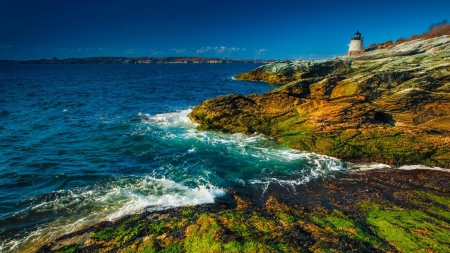 lighthouse on a moss covered rocky shore - shore, lighthouse, moss, sea, rocks