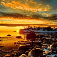 sunrise on a rocky seashore in winter