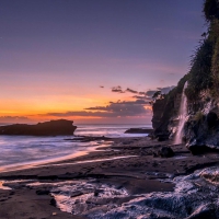 waterfalls on seaside cliffs at twilight