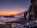 waterfalls on seaside cliffs at twilight