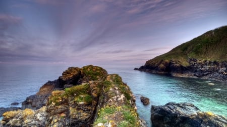 moss covered rock at a sea inlet - clouds, horizon, inlet, moss, sea, rocks