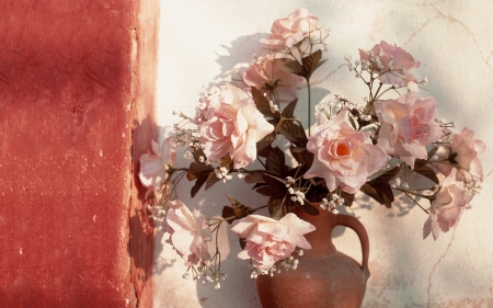 Pink roses in clay pot