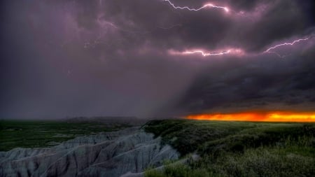 aggressive lightning storm over badlands - storm, rocks, lightning, badlands, clouds, sunset