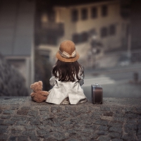 Girl, teddy bear and street