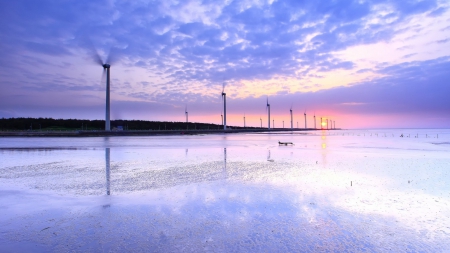 spinning windmill turbines in a lavender sunrise - shore, lavender, sea, sunrise, windmill