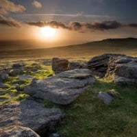 rocky rolling hills at sunset