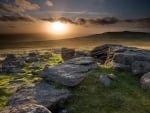 rocky rolling hills at sunset