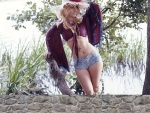 Cowgirl Peeking Over A Fence