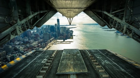 view of nyc waterfront from a plane's cargo doors - plane, doors, river, view, city