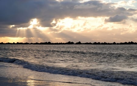 sunbeams over sea wave breaker - clouds, beach, sunbeams, wave breaker, sea, rocks