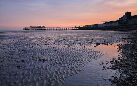 city pier on a rippled beach - beach, sundown, city, oier, ripple, sea