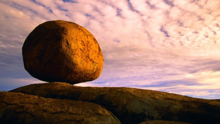 balancing big round rock - round, clouds, balance, bluff, rock