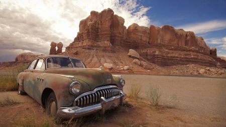 old buick at the end of the line in the desert - sky, car, flats, desert, old, rocks