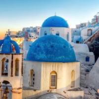 blue domes on a church in a greek town