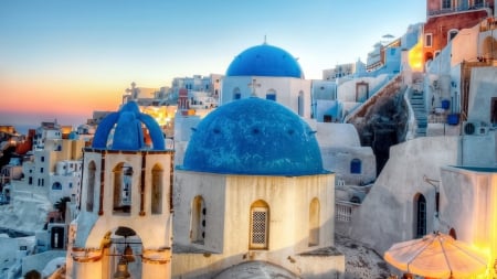 blue domes on a church in a greek town