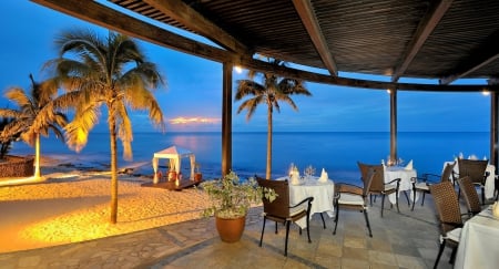 dining on a beach in the tropics at twilight - beach, restaurant, twilight, sea, lights