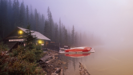 boat house on foggy lake louise in canada - house, fog, canoes, lights, lake, forest