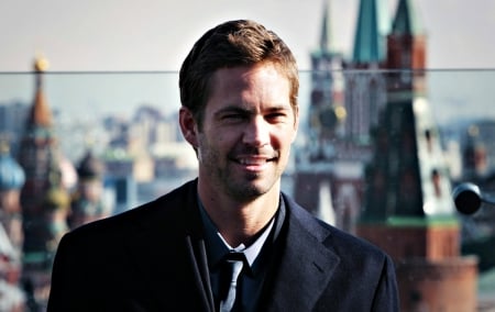 Paul Walker - black, paul walker, city, smile, actor, buildings, blue, man