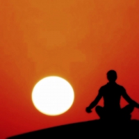 Meditating at sunset