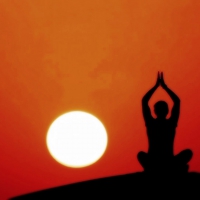 Meditating at sunset