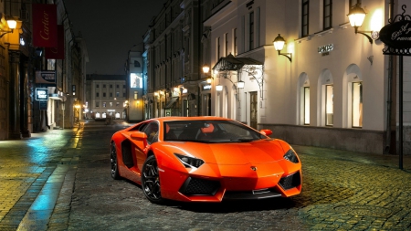 orange lamborghini aventador on cobblestones - cobblestones, street, car, orange, night, lights