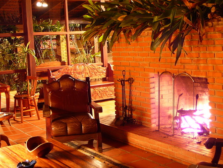 Chimenea de Arenal Lodge - chimenea de arenal, windows, lodge, table, fireplace, chairs, plants