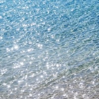 Translucent Sea water shimmer over white sand, Okinawa