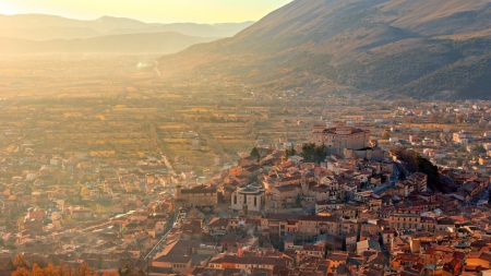 wonderful panoramic view of a hillside town in italy - hill, haze, town, sunrise, mountains, valley