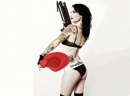 Cowgirl With A Big Gun - fun, tatoos, hats, fashion, models, cowgirls, style, dangerous, bikini, famous, westerns