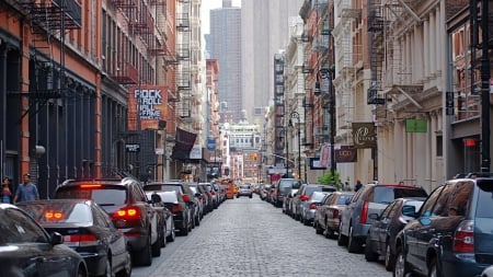 mercer street in the soho section of manhattan - cobblestones, street, skyscrapers, city, shops, cars