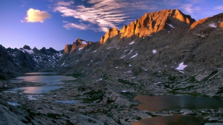 rugged mountain landscape - clouds, pools, sunshine, mountains, rocks