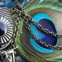 Owl pendant and peacock feather