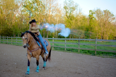 Cowgirl Shooting - horse, gun, dirt, grass, cowgirl, shooting, fence, smoke, trees