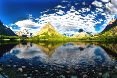 The Skies Of Swiftcurrent Lake - sky, water, mountains, crystal waters, nature, montana, forest, reflection, beautiful, clouds, glacier, glacier national park