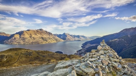 stack of stones above a river in queenstown new zealand - hills, river, city, stack, stones