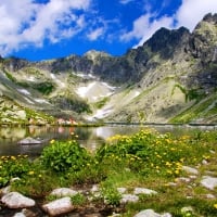 Mountain lake in background with high mountain