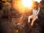 Cowgirl Sitting In A Sunset